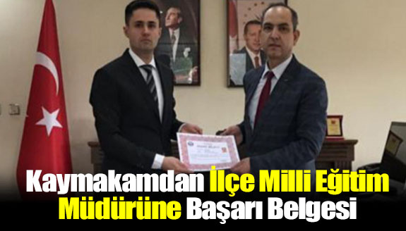 Kaymakamdan, İlçe Milli Eğitim Müdürüne başarı belgesi